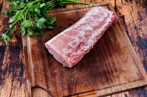 fresh pork loin on cutting board