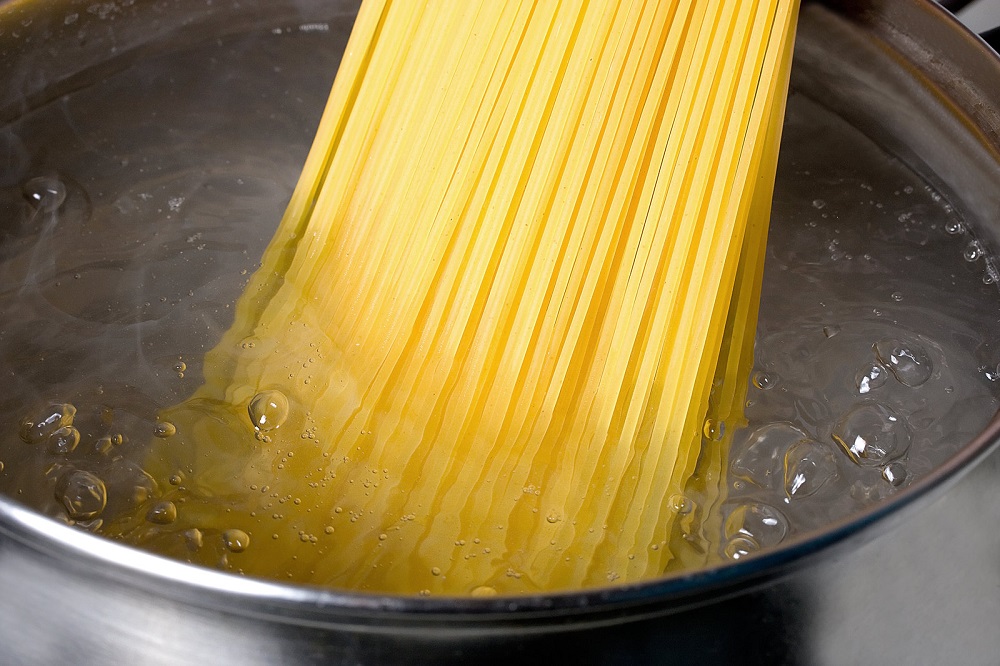 boiling pasta spaghetti in pot boiling water
